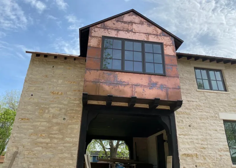 Copper metal panel facade on a stone building for Roof Repair in Rio del Mar